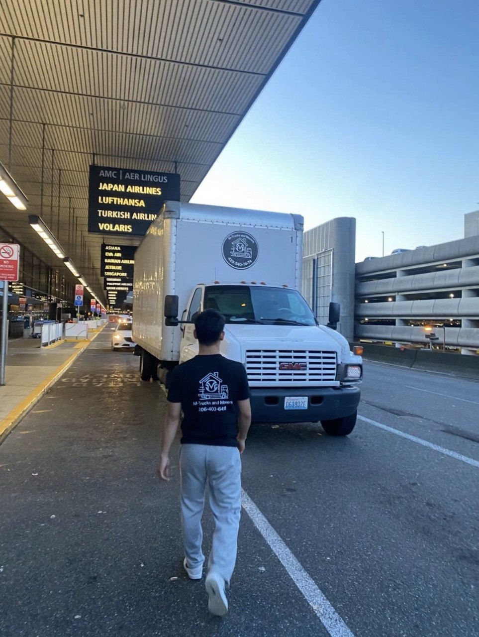 M-Trucks and Movers truck at airport pickup