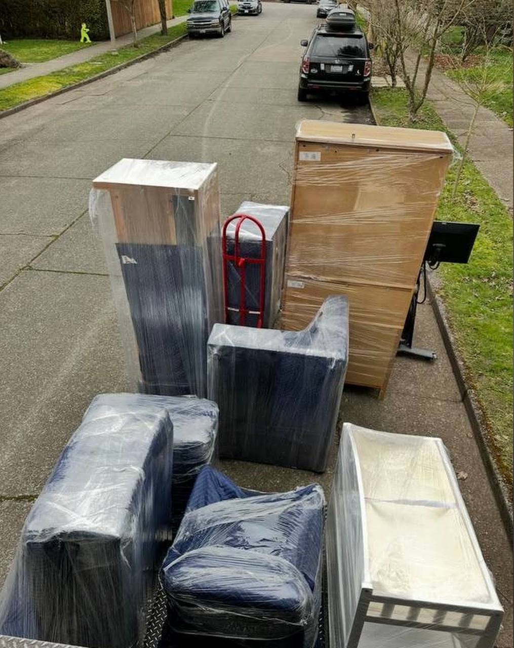 Wrapped furniture ready for loading on street